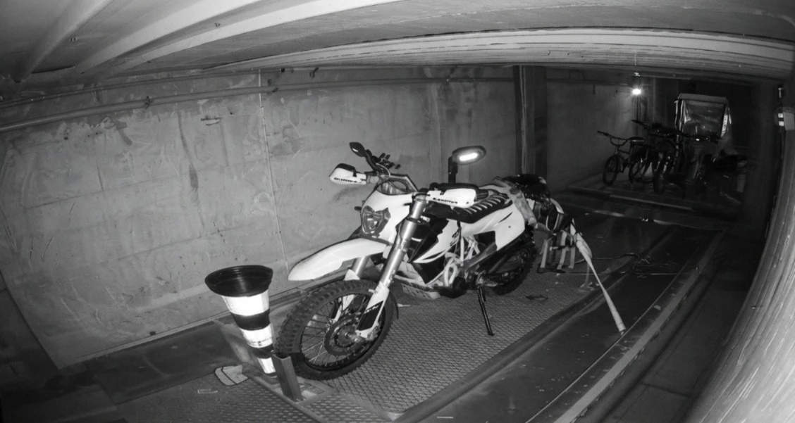 Motorbike stored in an automated parking cell